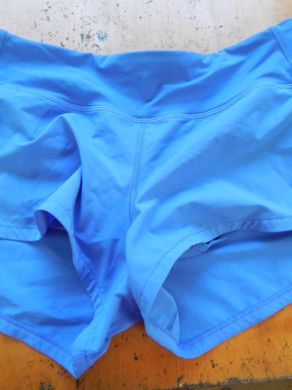 Blue running shorts with pants and zip pocket, XS.
